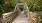 a wooden bridge with railings