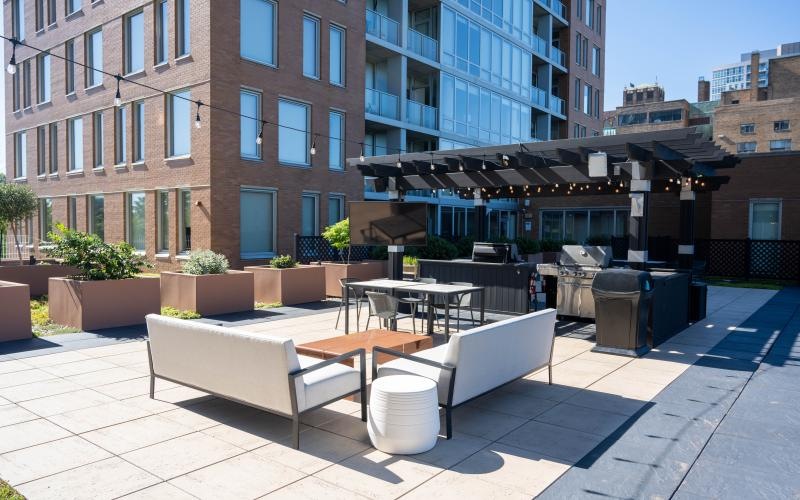 a courtyard with benches and tables