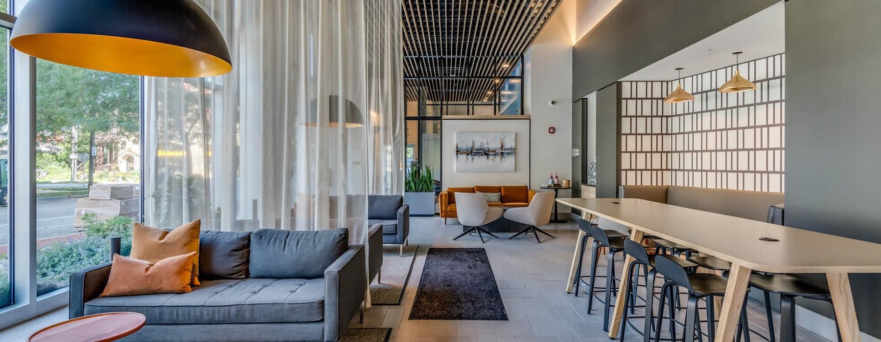 a lounge with a couch and tables