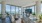 a living room with a large window and large tv