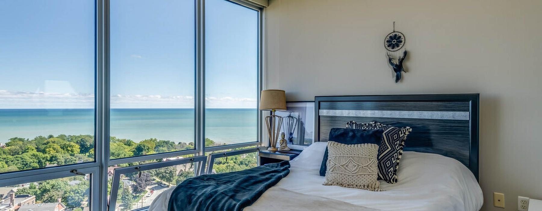 a bedroom with a large window